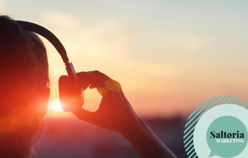 saltoria Person with headphones looking at the sun - demonstrating a customer listening to a brand tone of voice