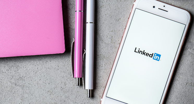 LinkedIn on a mobile phone on a desk