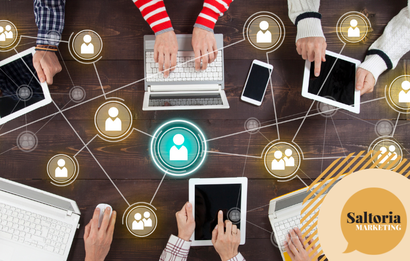 saltoria A group of people online networking on their laptops with icons and arrows coming out of their laptops