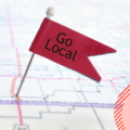 Red flag on a map to symbolise local marketing