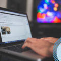 person on a laptop and creating a blog on wordpress