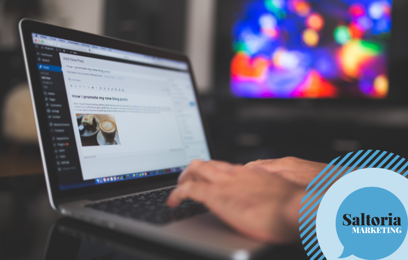 person on a laptop and creating a blog on wordpress