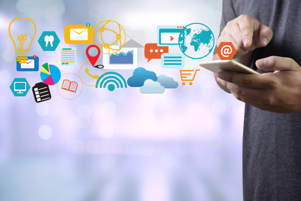 person on a smart phone with many icons coming out of the phone to reflect many marketing channels